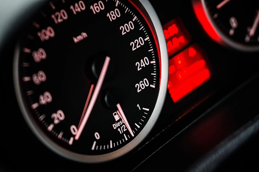 Close-up of car speedometer gauge at zero speed