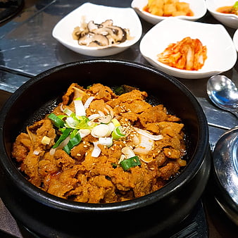 Korean spicy pork bowl with kimchi and mushrooms