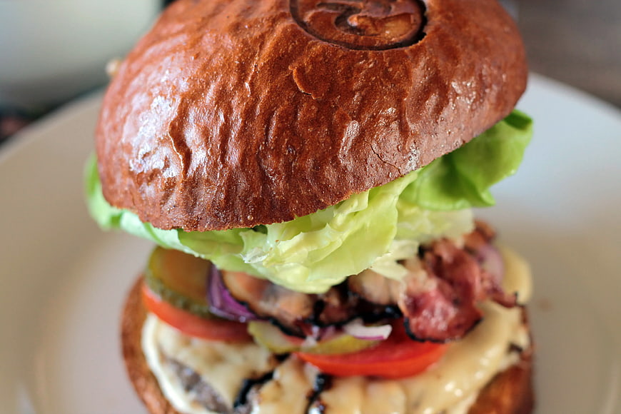 Close-up of Gourmet Burger with Bacon and Lettuce
