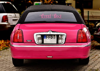 Rear View Of Pink Lincoln Town Car Taxi With Tussi Taxi Decal