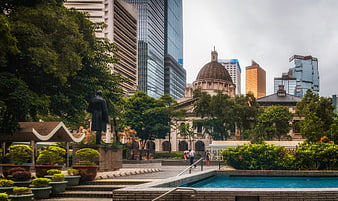 Hong Kong Central Plaza with Statue, Pool, and City Skyline