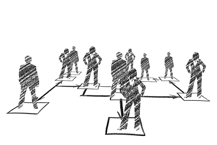 Hand-drawn sketch of business organization chart with people silhouettes