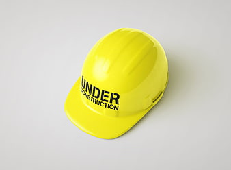Yellow Hard Hat Under Construction Isolated on White Background