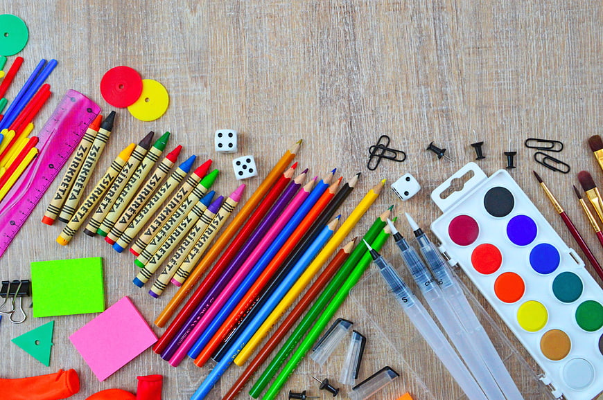 Colorful School Supplies Flat Lay on Wooden Desk