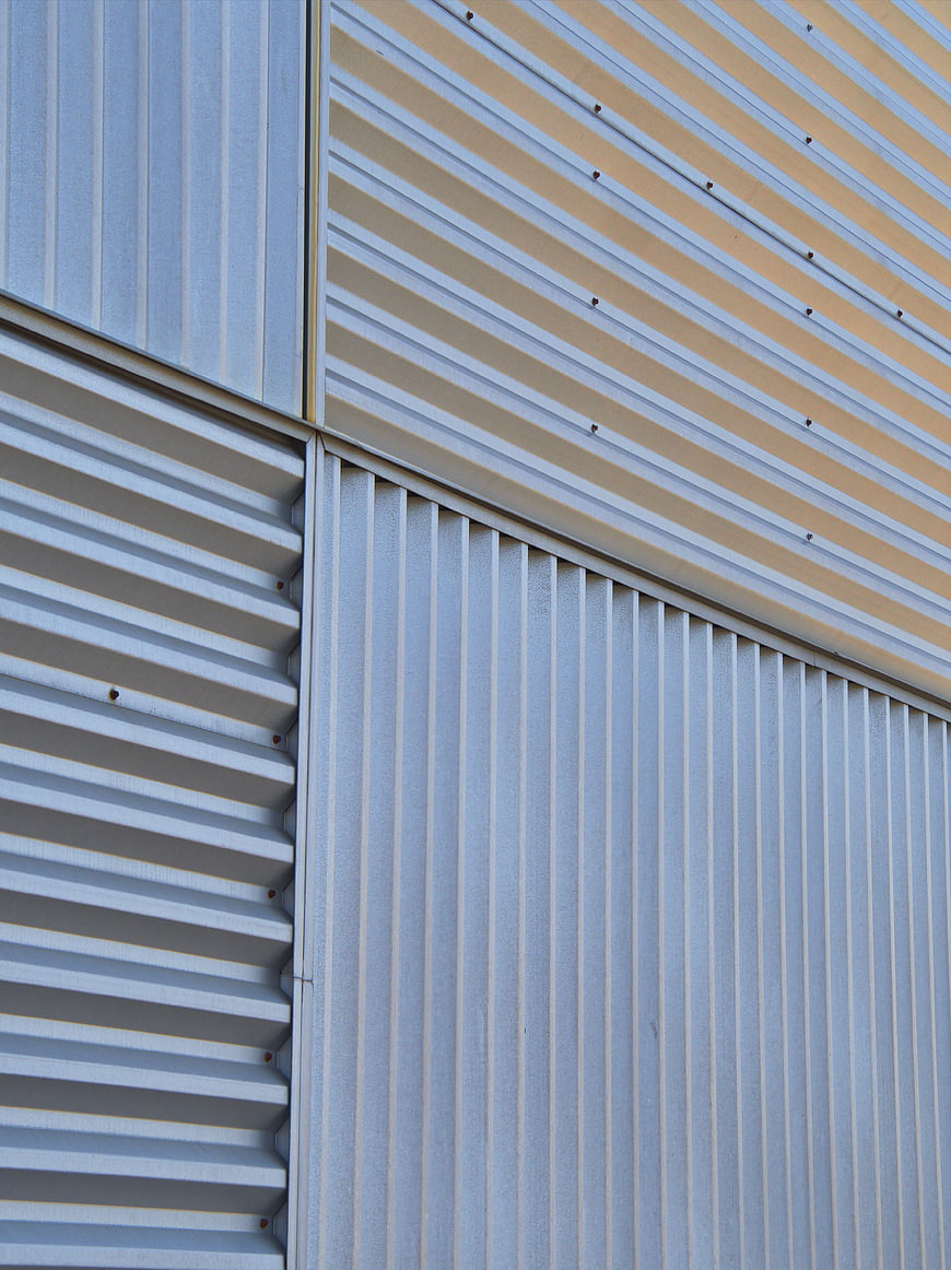 Abstract Corrugated Metal Wall Texture with Geometric Patterns