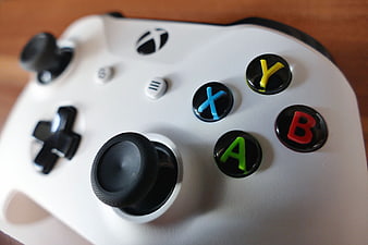 Close-up of White Xbox Controller with Colorful Buttons