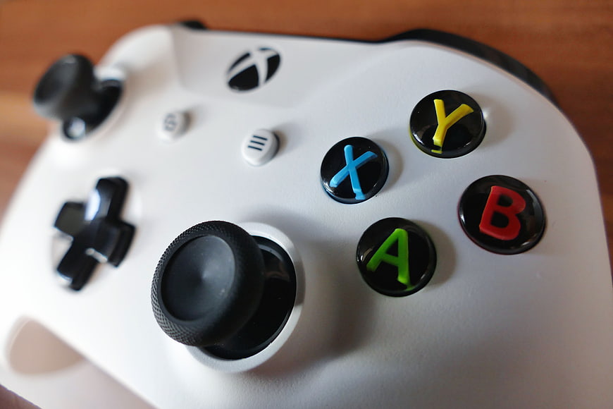 Close-up of White Xbox Controller with Colorful Buttons