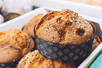 Freshly baked wholegrain muffins in a white tray