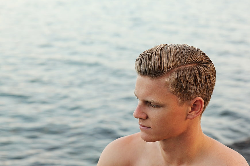 Profile of Young Man with Slicked Back Hair by Ocean