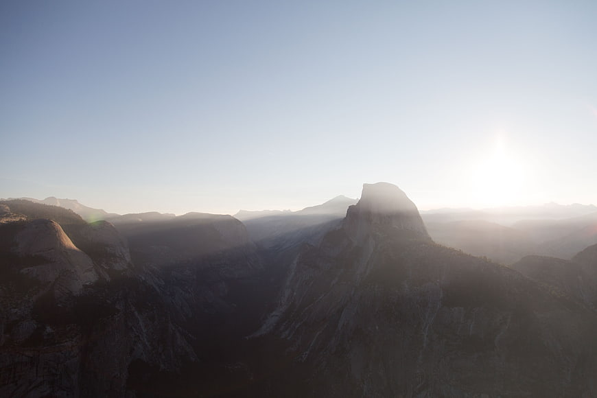Misty Sunrise Over Dramatic Mountain Valley Landscape