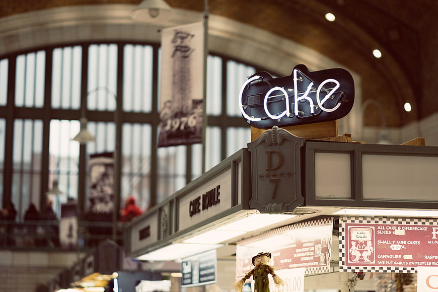 Neon Cake Sign at Indoor Market Stall