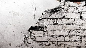 Textured White Brick Wall with Peeling Paint Background