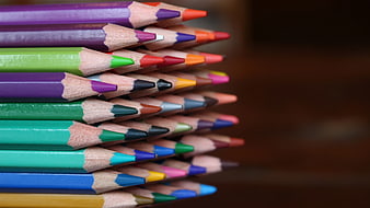 Stack of colorful pencils with blurred background