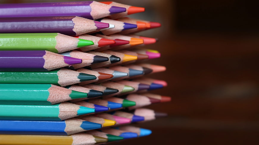 Stack of colorful pencils with blurred background