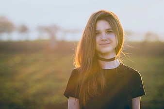 Young Woman with Long Hair in Golden Hour Backlight