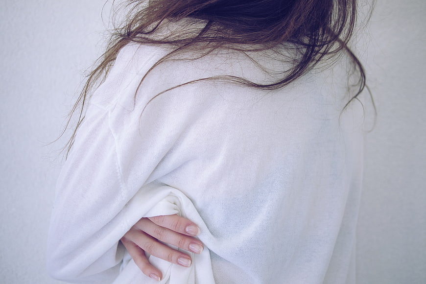 Woman in White Sweater Holding Sleeve