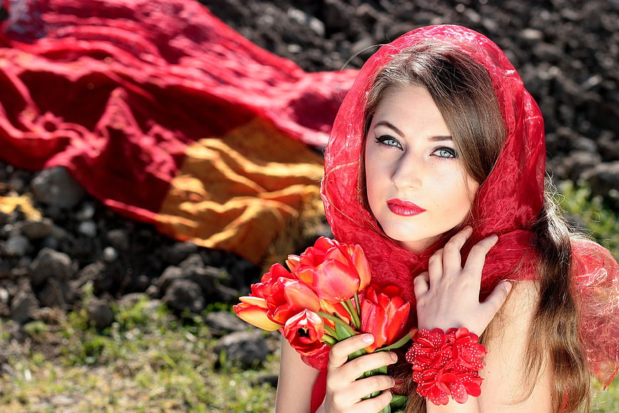 Woman in Red Scarf Holding Tulips in Nature