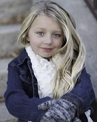 Portrait of a smiling blonde girl in winter clothes