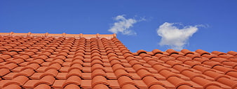 Terracotta Roof Tiles Against Blue Sky