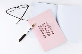 Pink Hello Notebook, Glasses, and Girl Boss Pen Flat Lay