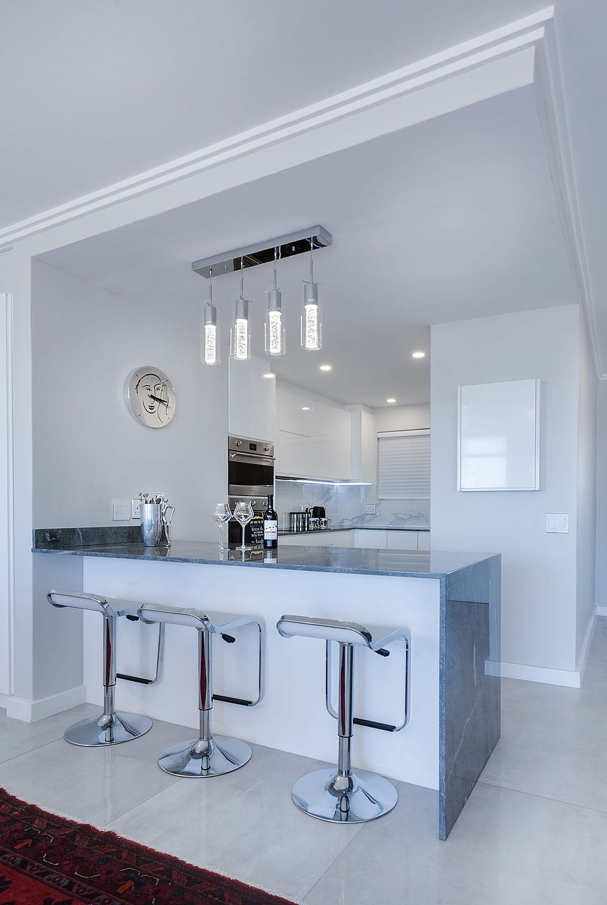 Modern Minimalist Kitchen Island With Chrome Bar Stools