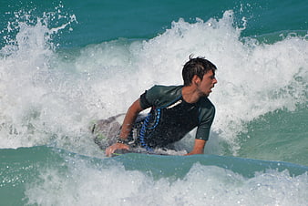 Man surfing on a wave in the ocean