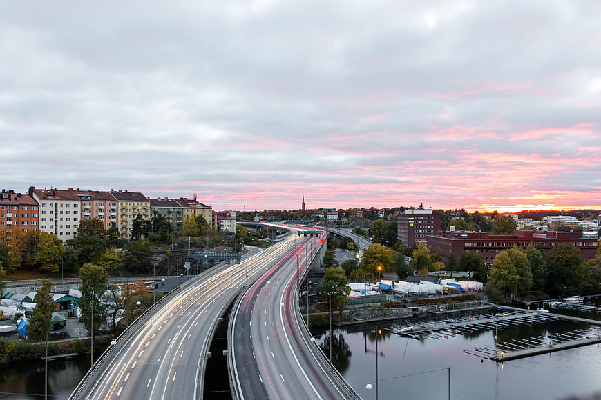 Long Exposure City Highway at Sunset with Light Trails