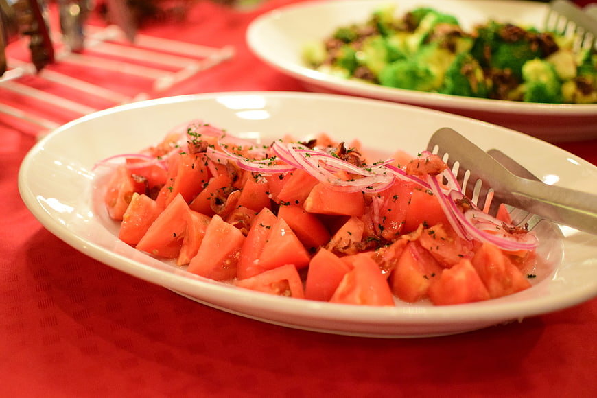 Fresh Tomato Salad with Red Onions on White Plate