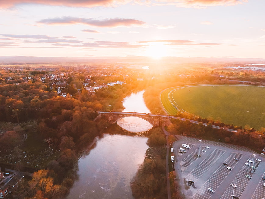 Aerial View of River Bridge and Racecourse at Golden Sunset
