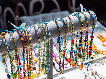 Colorful Handmade Beaded Bracelets on Display Stand