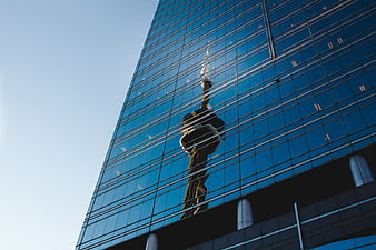 Reflection of CN Tower on Blue Glass Skyscraper