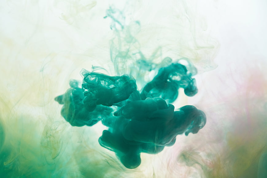 Abstract Green Ink Diffusing in Water