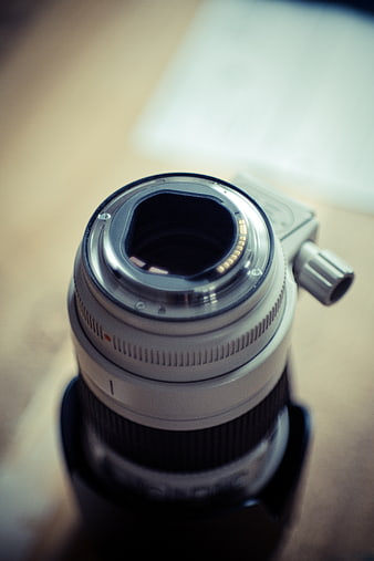 Close-up of camera lens mount on wooden table