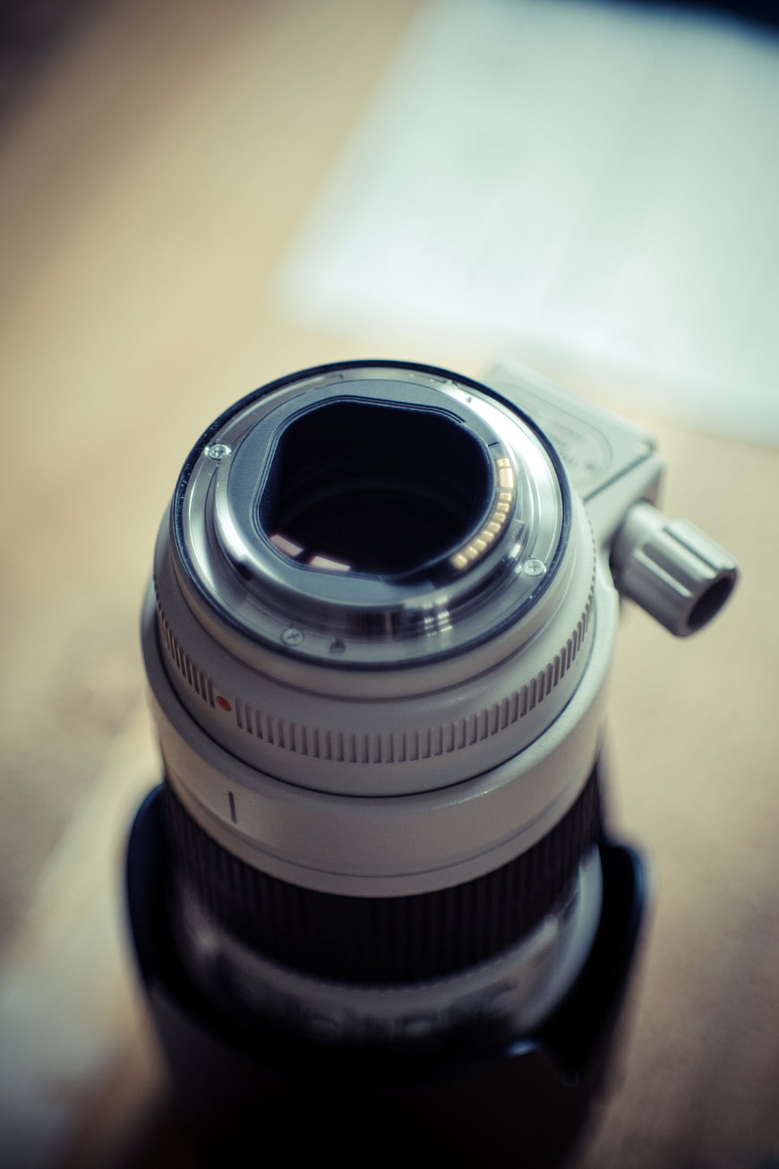 Close-up of camera lens mount on wooden table