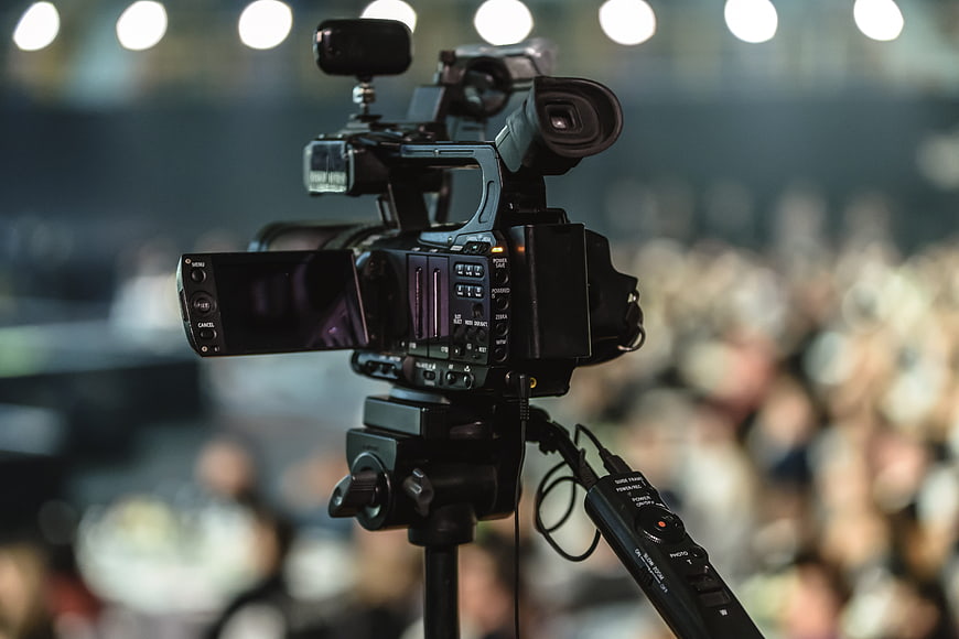 Professional Video Camera On Tripod At Live Event