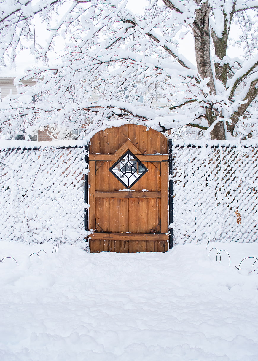 Snowy Wooden Garden Gate with Stained Glass Diamond