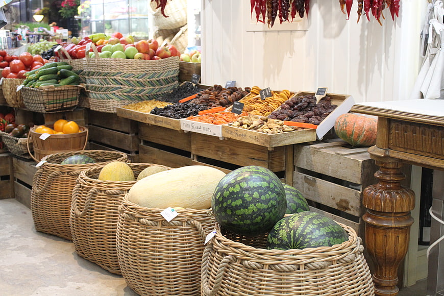 Fresh Fruits and Vegetables in Wicker Baskets at Market