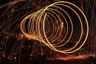 Steel wool fire spinning long exposure light painting art