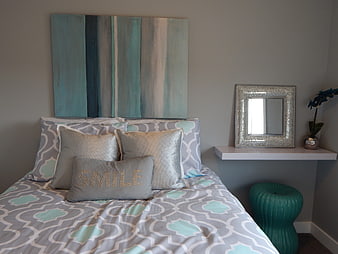 Modern Bedroom Interior With Gray And Teal Bedding And Abstract Wall Art