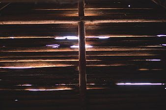 Light Leaks Through Wooden Slats in Dark Interior