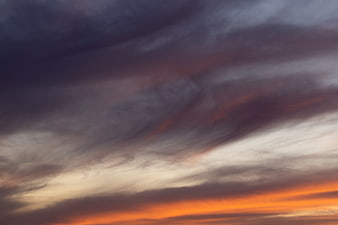 Dramatic sunset sky with vibrant orange and purple clouds