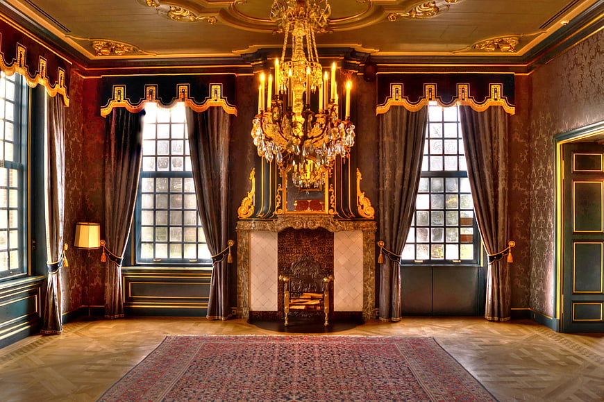 Luxurious Baroque Interior with Gold Chandelier and Fireplace
