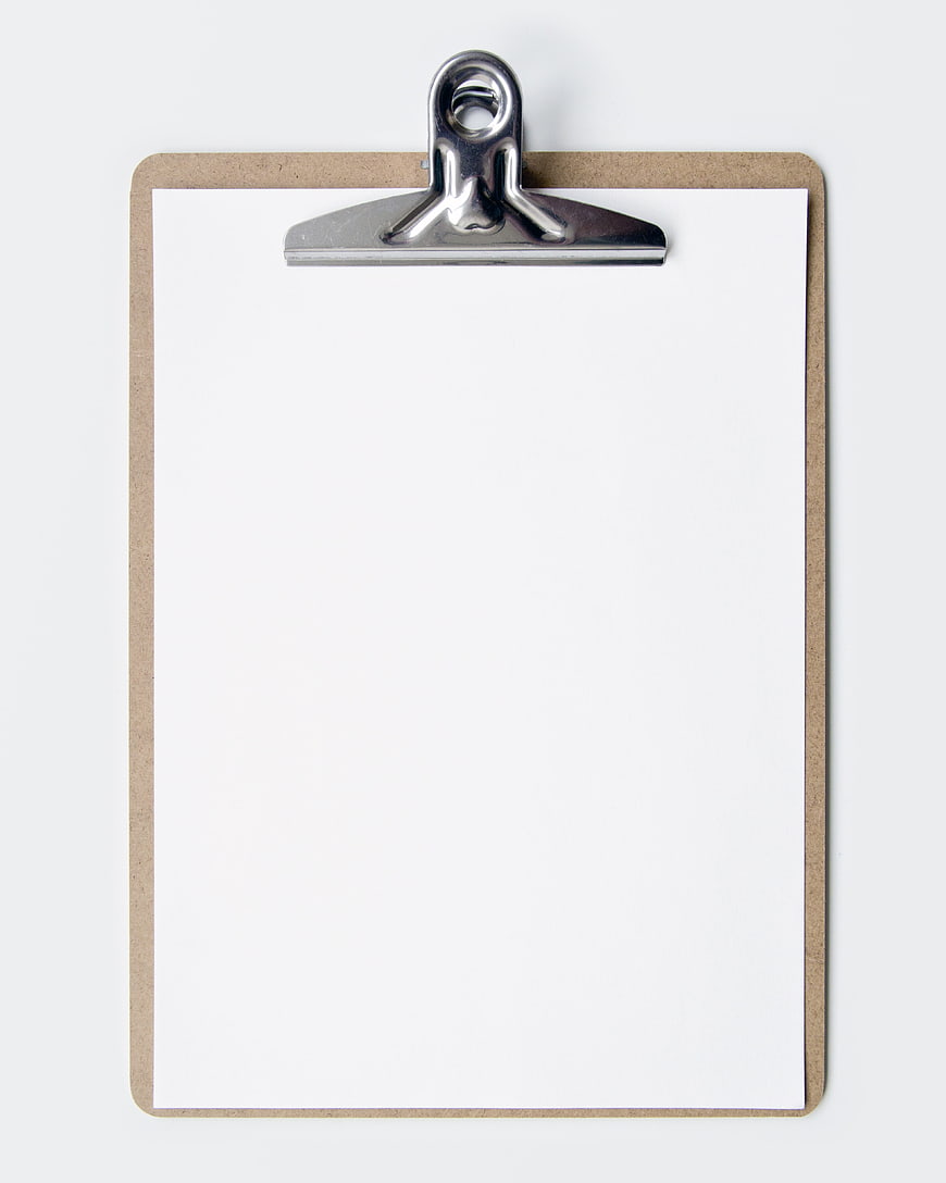 Blank clipboard with white paper on white background