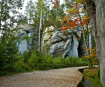 Autumn path winding through Andrsbach Rock City sandstone formations