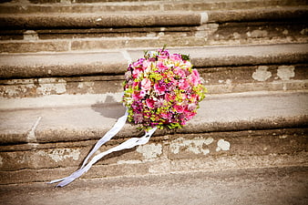 Pink and Green Wedding Bouquet on Stone Stairs
