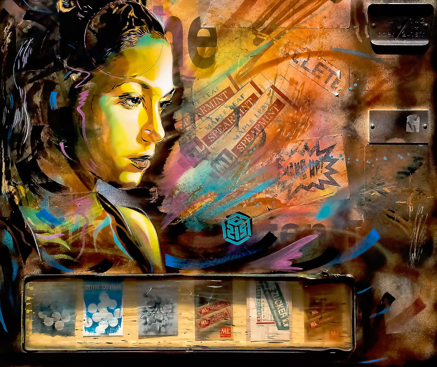 Colorful street art portrait of a woman with mixed media textures