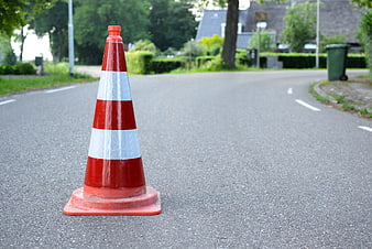 Orange Traffic Cone on Asphalt Road with Copyspace