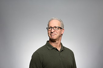 Portrait of a smiling senior man with glasses and white hair