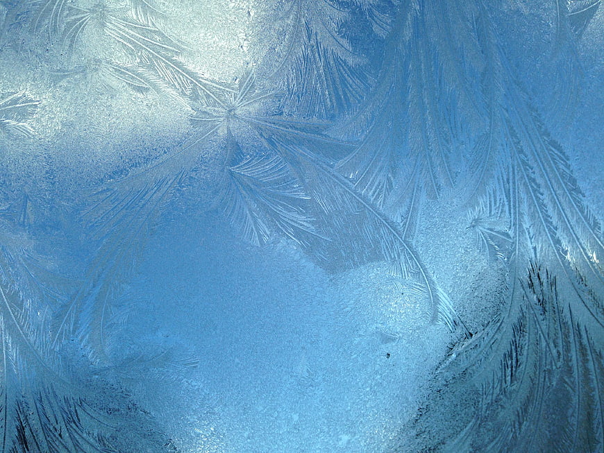 Abstract Blue Frost Patterns on Frozen Glass Window