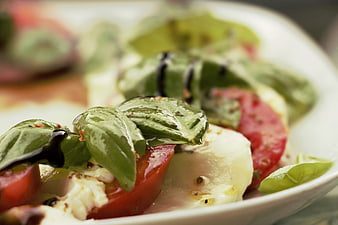 Close-up of fresh Caprese salad with balsamic glaze